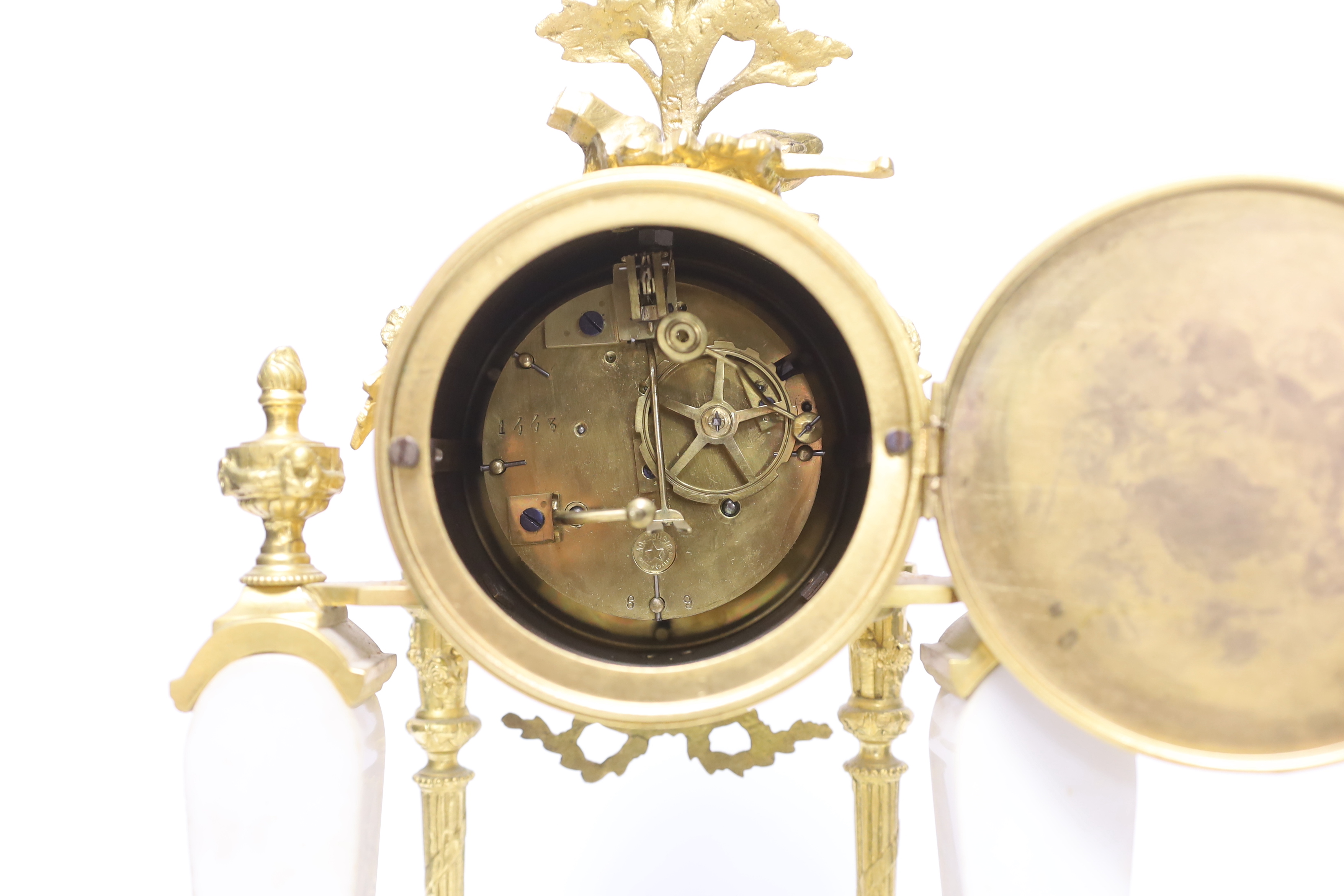 An early 20th century white marble and ormolu clock garniture with Arabic enamelled dial, 42cm high
